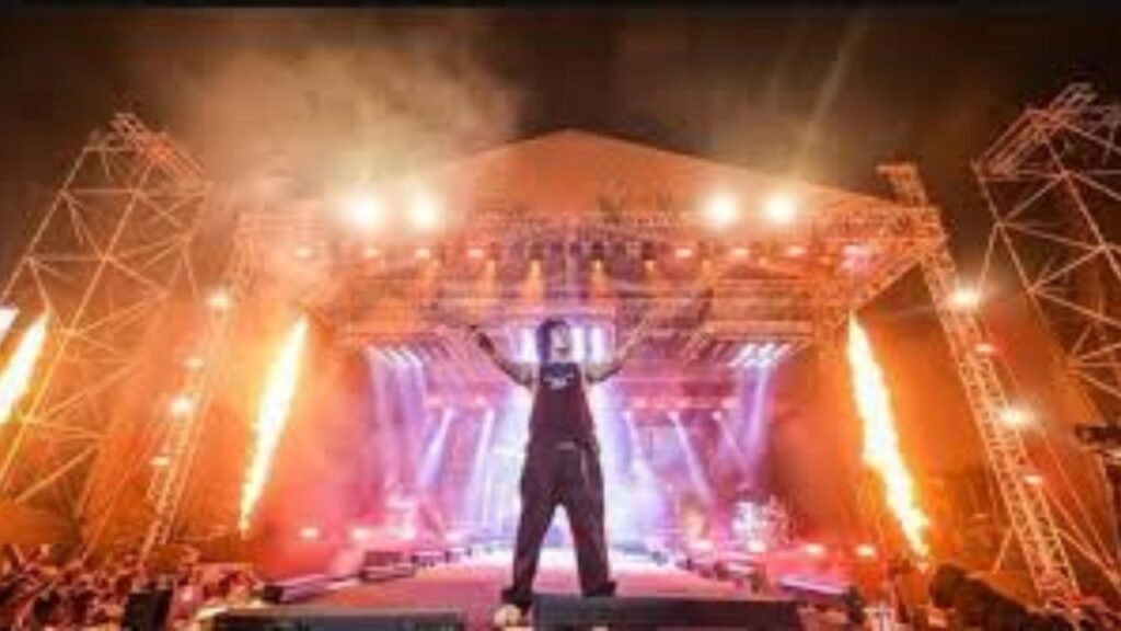 Massive outdoor music festival stage with hanumankind